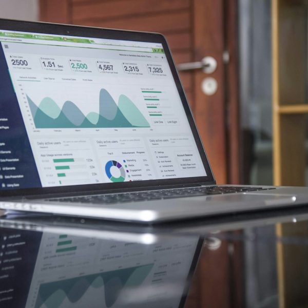 Laptop displaying business analytics and performance charts