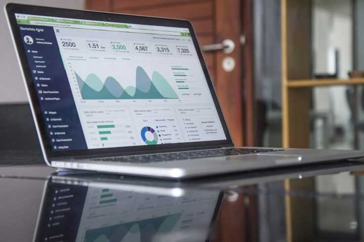 Laptop displaying business analytics and performance charts
