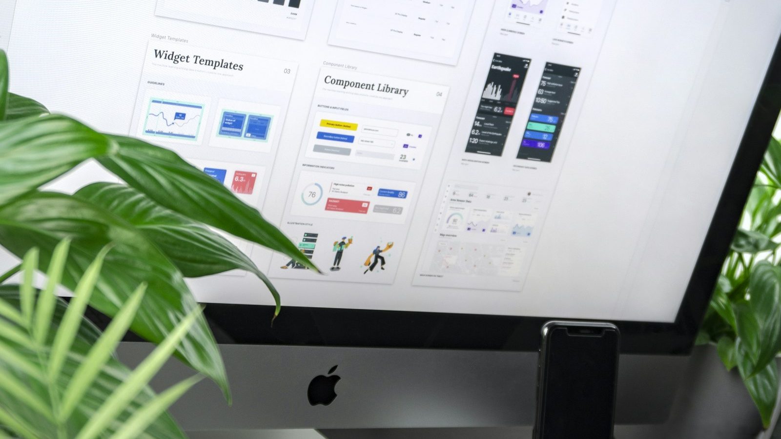 Designer working on a digital interface at a desk