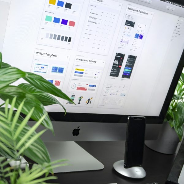 Designer working on a digital interface at a desk