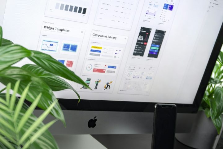 Designer working on a digital interface at a desk