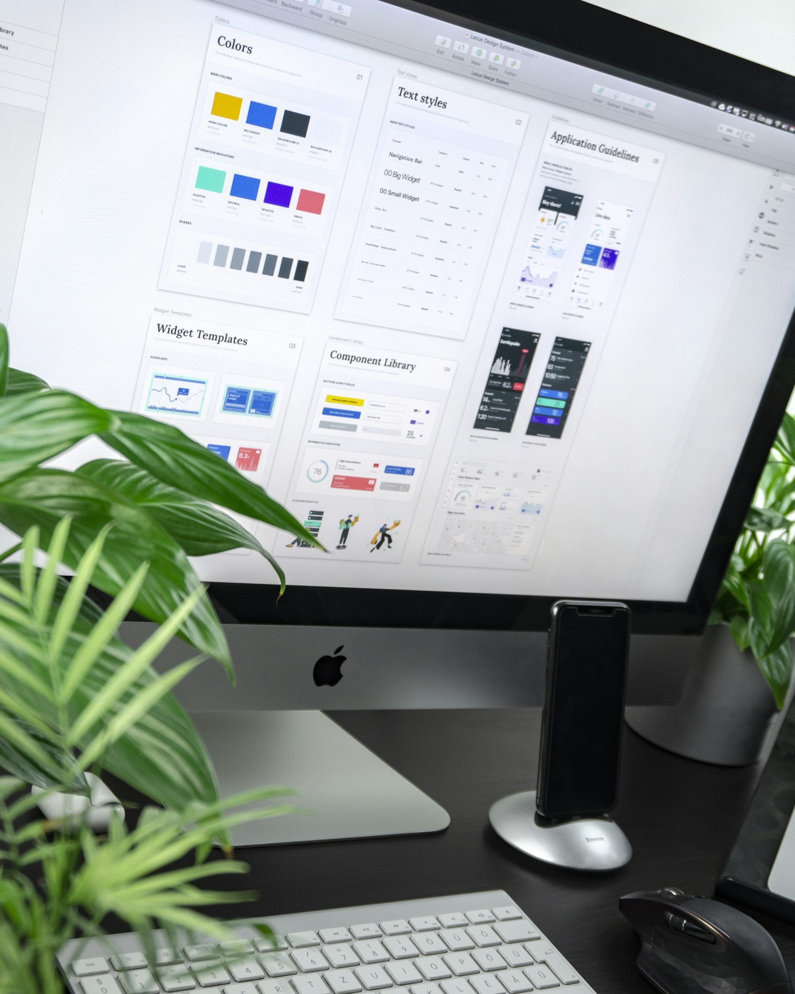 Designer working on a digital interface at a desk